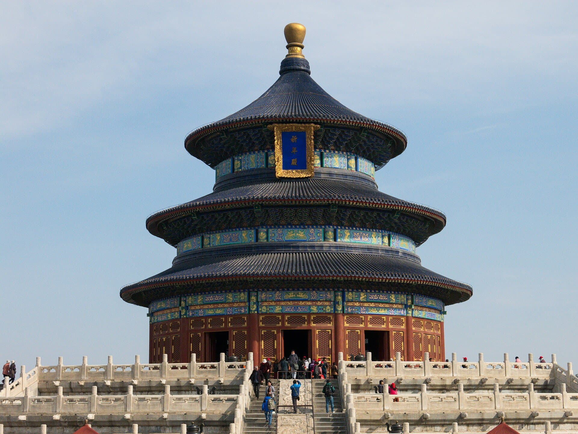 The round, triple-roofed Hall of Prayer for Good Harvests at Beijing's Temple of Heaven, on its white marble terrace under a pale blue sky